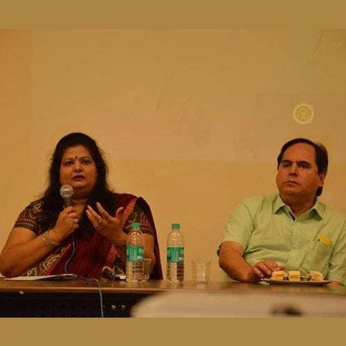 Mallikaa speaking on a panel